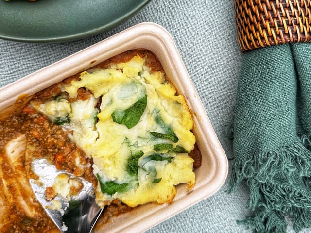 Beef cottage pie topped w/ sauerkraut & spinach potato