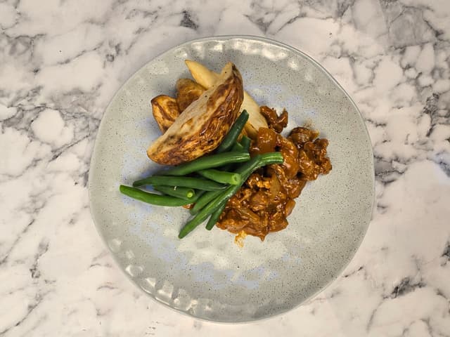 Peri Peri Beef with Potato Wedges & Beans