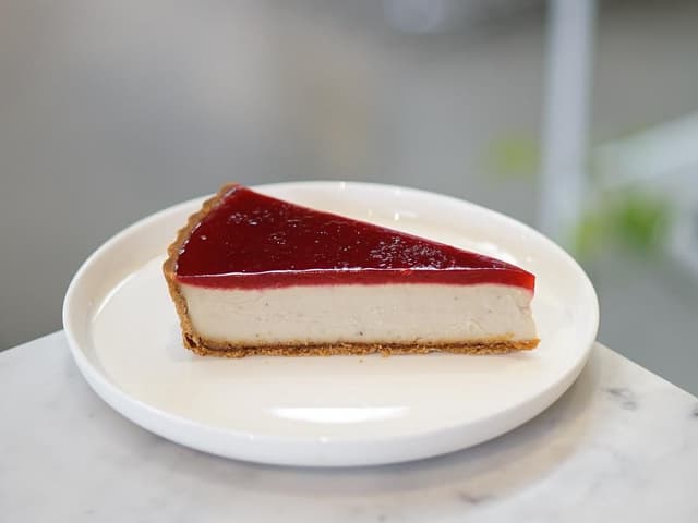 Jasmine & Raspberry Cheesecake Tart (slice)