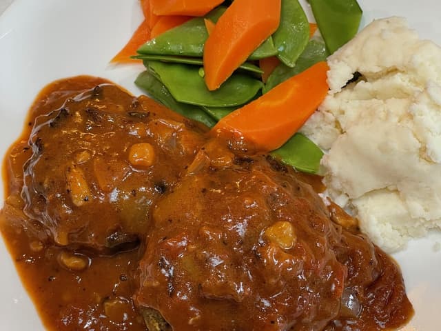 Rissoles, tomato & onion gravy with Mash & Veg