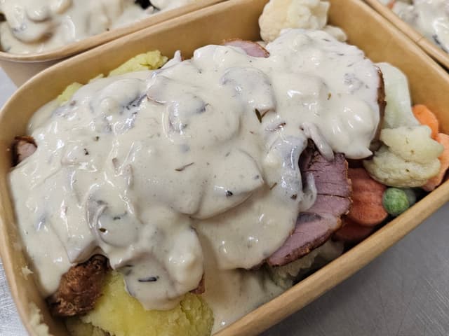 Pork fillet with mash, veg and a creamy mushroom sauce.