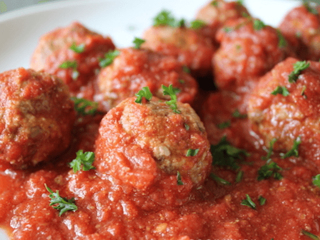 Italian Pork, Beef and Parmesan Meatballs in basil Tomato Sugo