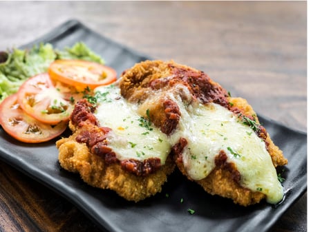 BBQ chicken parmi with potato wedges