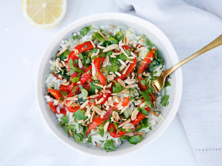 Zucchini lemon risotto with toasted almonds and roasted red capsicum