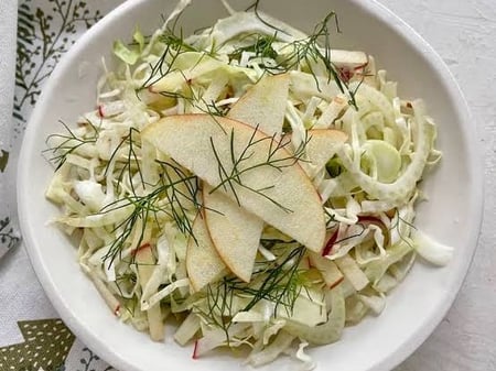 Apple wombok and fennel slaw with pistachios and cranberries