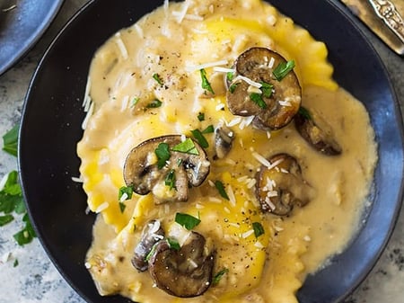 Spinach and Three Cheese Ravioli w/ Mushroom, Spinach and Pine Nut Sauce