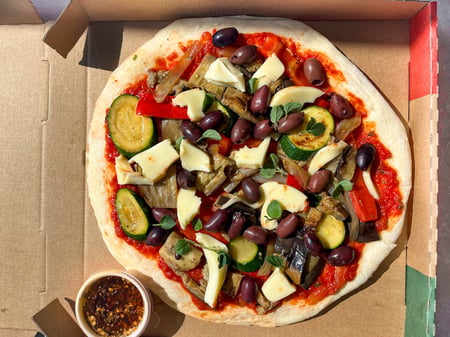 Vegetable pizza with olives, Byron bay mozzarella, chilli & oregano oil