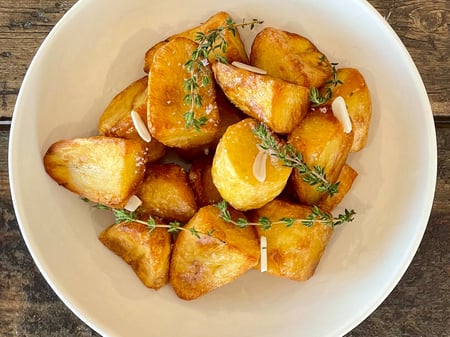 Twice cooked dutch creme potatoes roasted with garlic & thyme