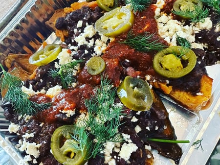 Roasted Sweet Potatoes stuffed with Black beans, topped with Grilled Halloumi