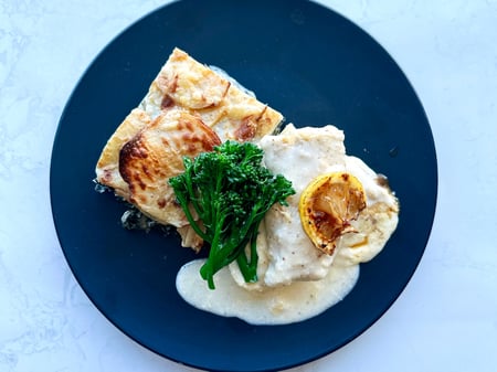 Snapper Fillet with lemon cream sauce and silverbeet and potato grati