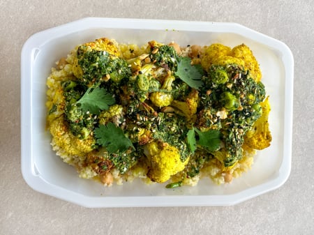 Roasted cauliflower with cous cous, chickpeas and chermoula sauce