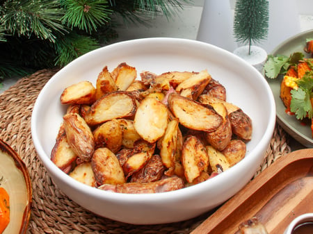 Twice cooked crispy duck fat kiplfer potatoes, roasted garlic and thyme