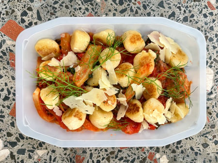 Potato gnocchi with pork sausage, spinach, fennel & cherry tomato sauce