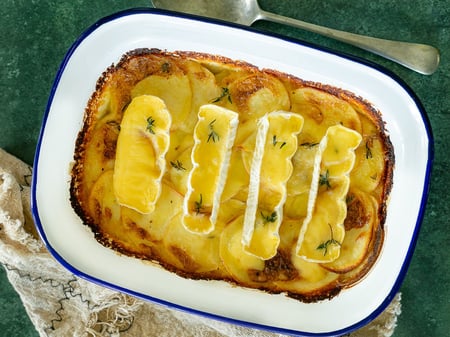 Oven baked potato, brie and thyme gratin
