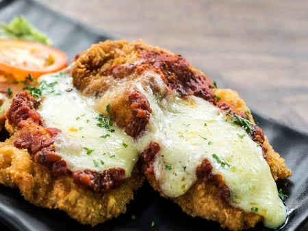 Chicken Parmi with herbed potatoes