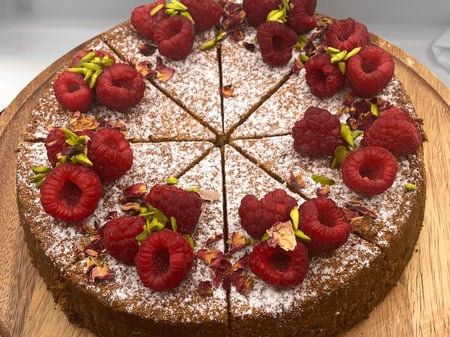Pistachio, burnt honey, cardoman, rose and raspberry cake