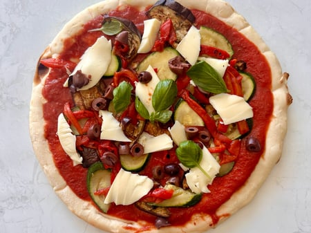 Vegetable pizza with olives, Byron bay mozzarella, chilli & oregano oil