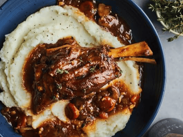 SLOW COOKED LAMB SHANK with mash & greens