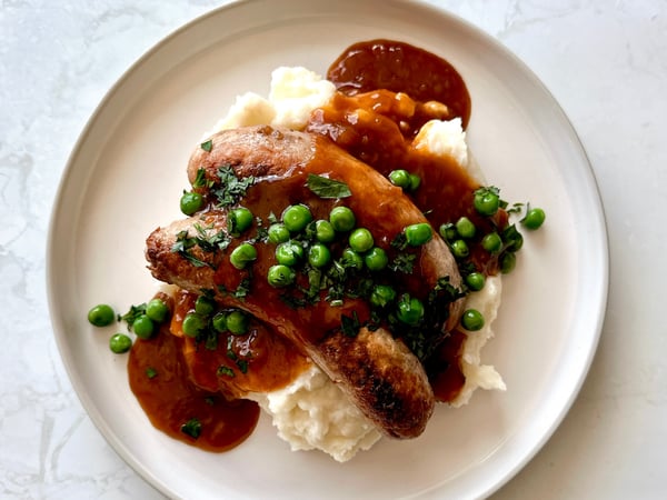 Pork & Fennel Sausages, mashed potato, garden peas and onion gravy