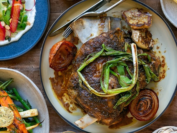 Slow Roasted Lamb Shoulder with Charred Scallions, Green Olive and White Bean Pu