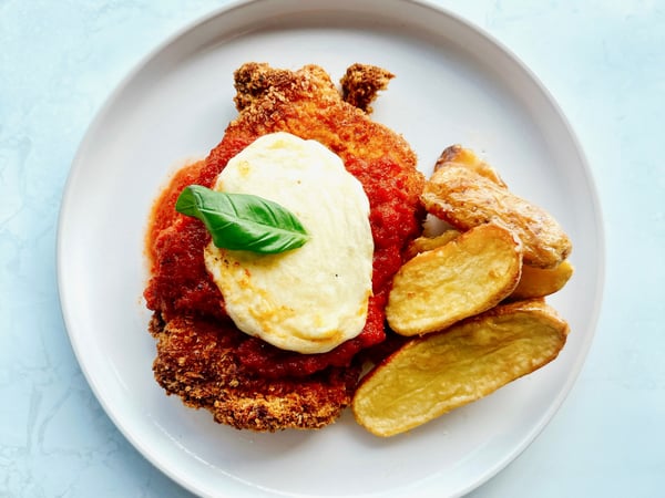 Chicken Parmigiana with potato wedges