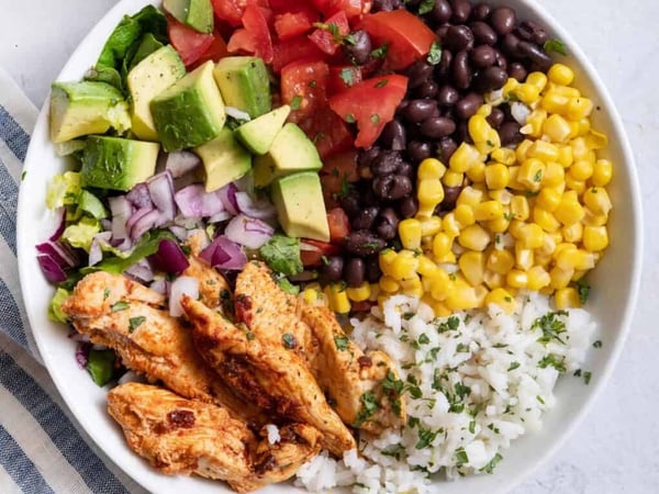 MEXICANO BOWL .. jalapeno poppers, black beans , corn fritters ,  chicken, rice.