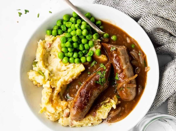 Gourmet Beef Sausages w/ Mashed potato, peas & onion gravy