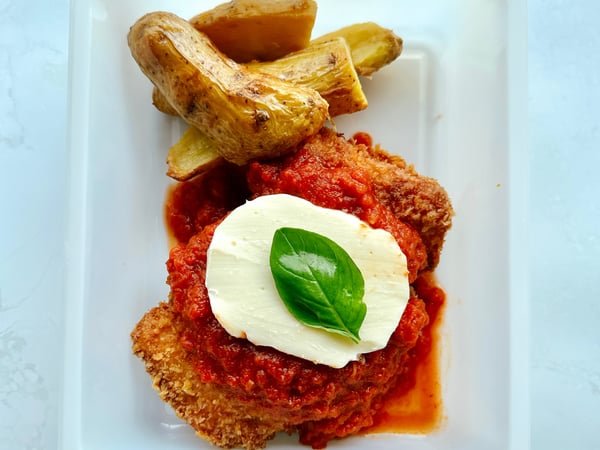 Chicken Parmigiana with potato wedges