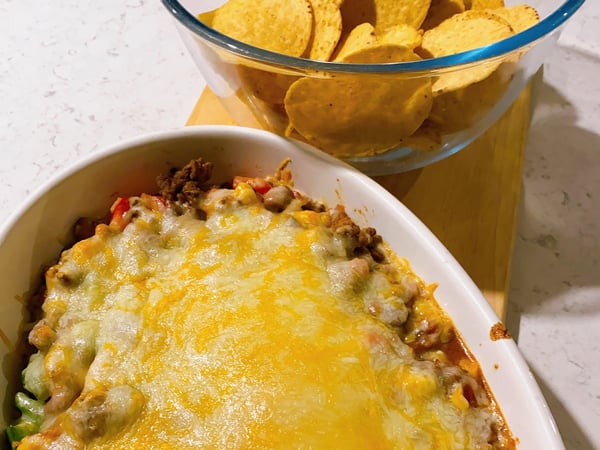 Beef Burrito Bowl topped with Mexican Cheese Blend & Corn Chip Dippers 499 cal