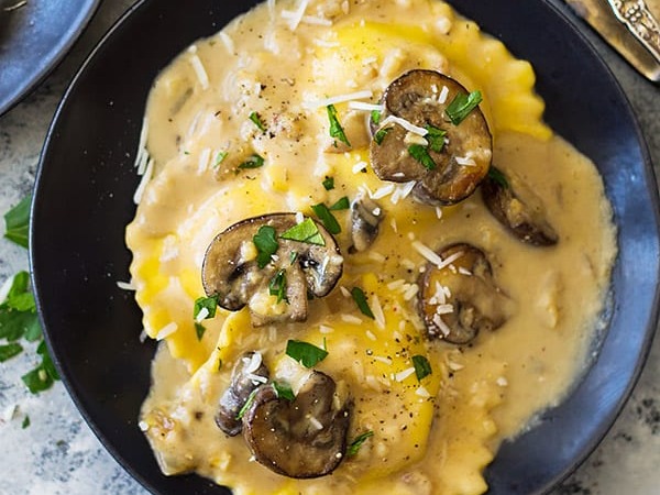 Spinach & Three Cheese Ravioli w/ Creamy Mushroom & Pine Nut Sauce