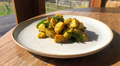 Potatoes cooked with mustard and curry leafs 