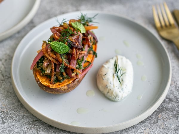 Baked sweet potato with lentil, swiss chard,  fried onions and herb labneh