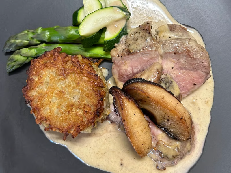 Pan Fried Pork Chop, Roast Apple, Roesti Potato & Steamed Greens