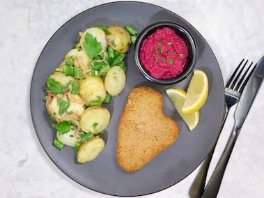 Syndian classic schnitzel, German potato salad and beetroot wasabi relish