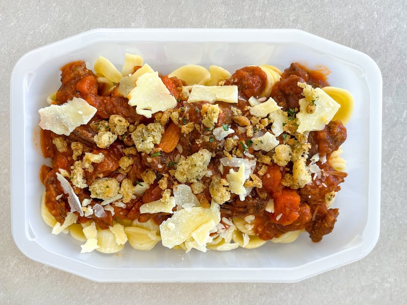 Braised beef ragu, rigatoni pasta, parmesan and focaccia pangrattato