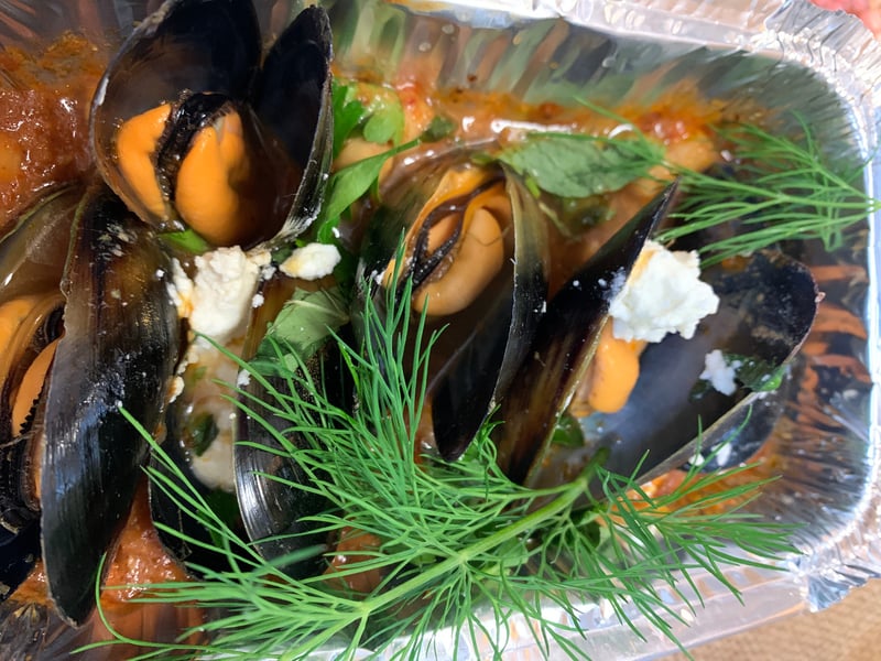 Harrisa Mussels with chic peas and goats curd