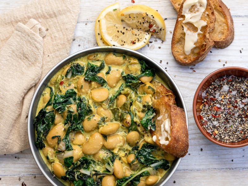 Turmeric Braised Butter Beans, Enriched with Greens