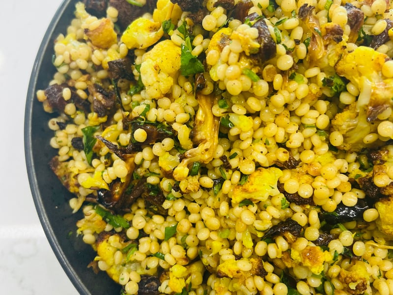 roasted cauliflower, date and pearl cous cous salad