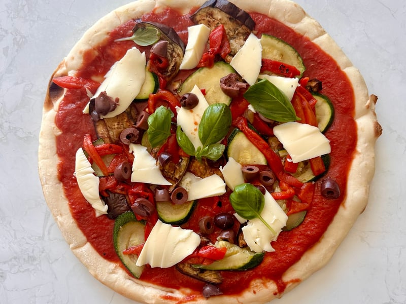 Vegetable pizza with olives, Byron bay mozzarella, chilli & oregano oil